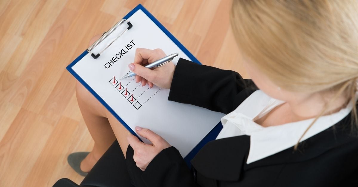 woman filling out a checklist