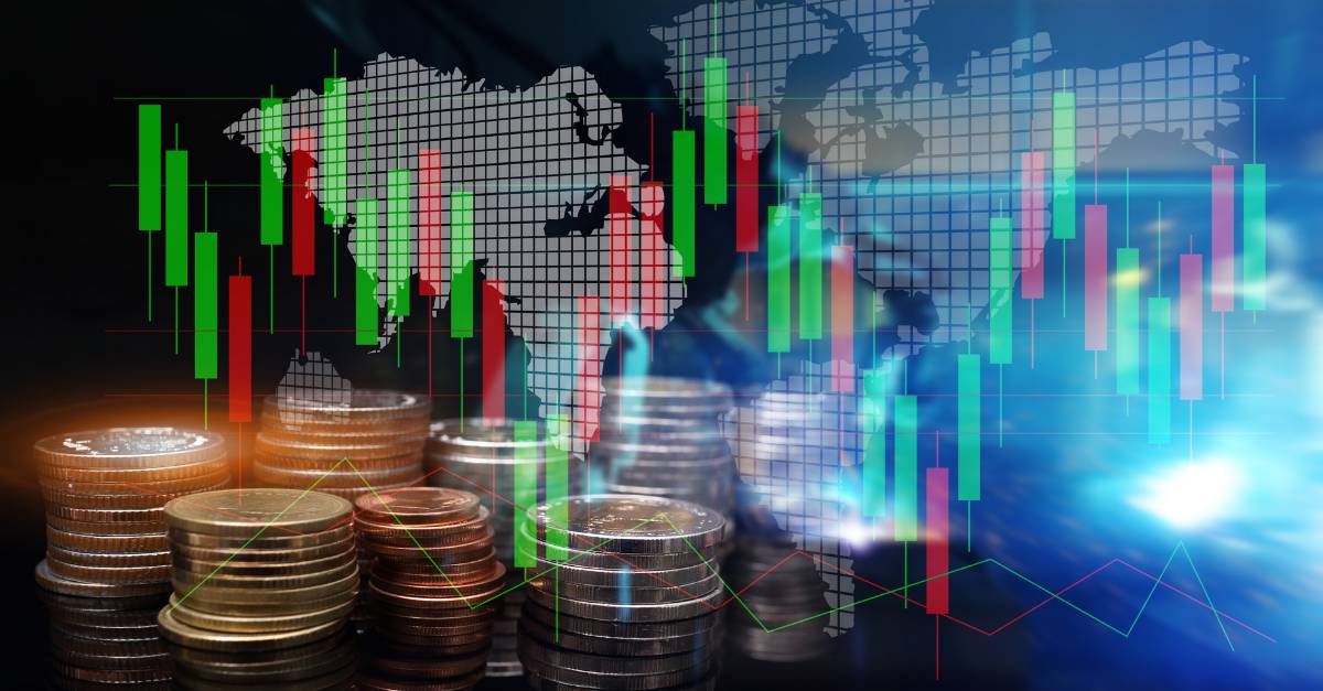 trading chart and pile of gold coins